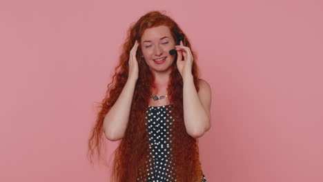 Smiling-redhead-girl-wears-headset,-freelance-worker,-call-center,-support-service-operator-helpline