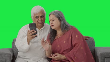 Old-Indian-couple-talking-on-video-call-Green-screen