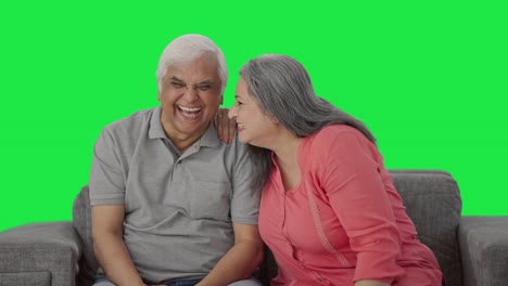 Indian-old-wife-telling-a-secret-to-her-husband-in-ear-Green-screen