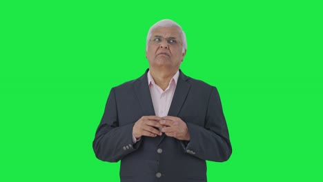 Confused-Indian-senior-manager-thinking-Green-screen