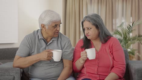 Indian-old-couple-drinking-tea-and-talking