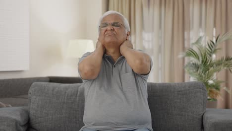 Sick-Indian-old-man-suffering-from-neck-pain