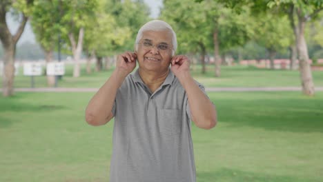 Guilty-Indian-old-man-saying-sorry-and-apologizing-in-park