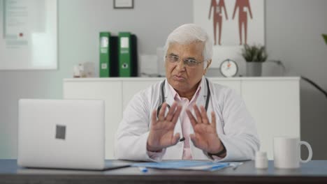 Indian-senior-doctor-talking-to-the-patient