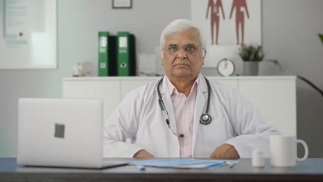 Indian-senior-doctor-staring-at-the-camera