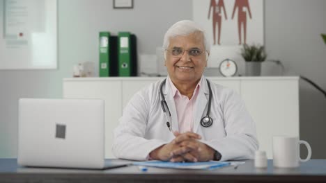 Happy-Indian-senior-doctor-smiling