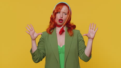 Redhead-woman-showing-nonsense-hands-gesture,-gossips,-empty-fake-promises,-liars,-yellow-background