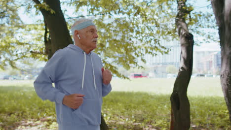 Athletic-fitness-senior-sport-runner-man-grandfather-training-workout-cardio-in-city-park-at-morning