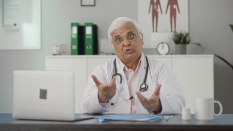 Angry-Indian-senior-doctor-shouting-on-someone