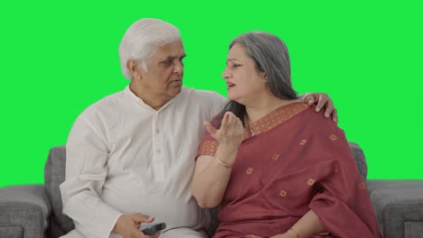 Old-Indian-couple-watching-TV-Green-screen