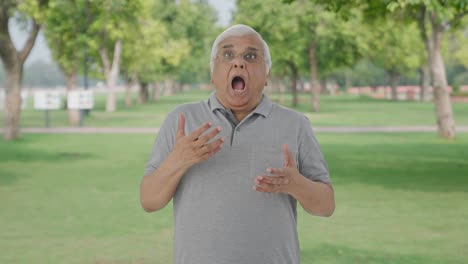 Sick-Indian-old-man-having-an-Asthma-attack-in-park