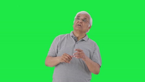 Frustrated-Indian-old-man-flying-a-mosquito-Green-screen