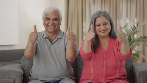 Happy-Indian-old-couple-showing-thumbs-up