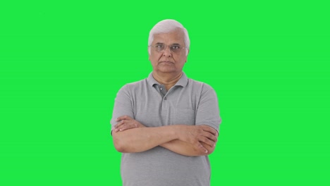 Confident-Indian-old-man-standing-crossed-hands-Green-screen