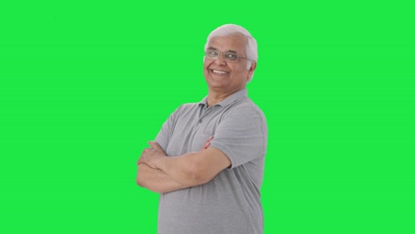 Portrait-of-Happy-Indian-old-man-standing-crossed-hands-Green-screen