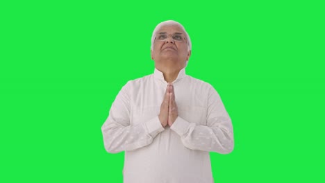 Religious-Indian-old-man-praying-to-God-Green-screen