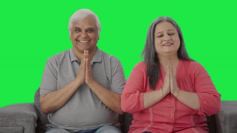 Happy-Indian-old-couple-doing-Namaste-Green-screen