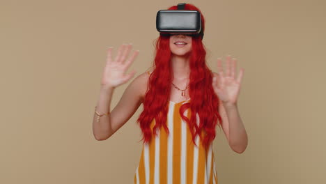 Girl-using-virtual-reality-futuristic-technology-VR-headset-helmet-to-play-simulation-3D-video-game