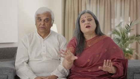 Angry-Indian-old-couple-shouting-at-someone