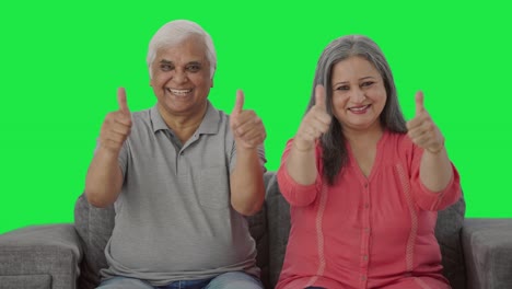 Happy-Indian-old-couple-showing-thumbs-up-Green-screen