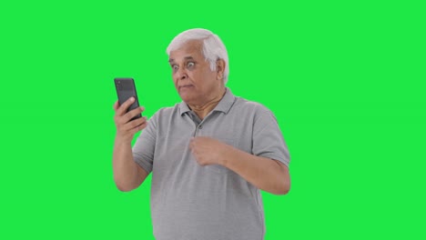 Angry-Indian-old-man-shouting-on-video-call-Green-screen