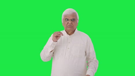 Disgusted-Indian-old-man-smelling-something-bad-Green-screen