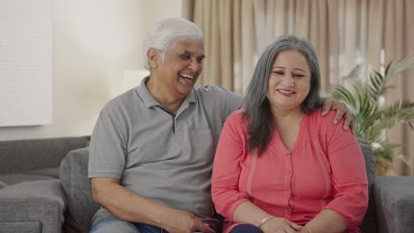 Happy-Indian-old-couple-talking-and-smiling