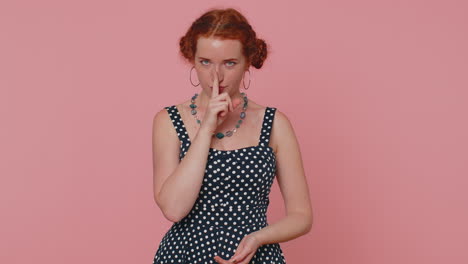 Girl-presses-index-finger-to-lips-makes-silence-gesture-sign-do-not-tells-secret,-shh-be-quiet