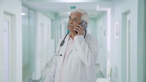 Angry-Indian-senior-shouting-to-someone-on-call