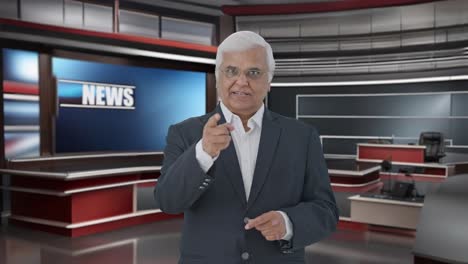 Indian-senior-journalist-reading-news