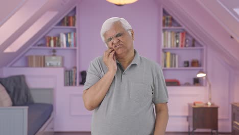 Indian-old-man-suffering-from-toothache