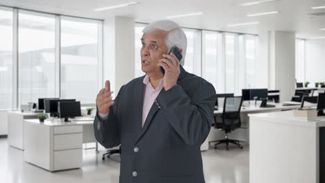 Angry-Indian-senior-manager-shouting-on-someone-over-call