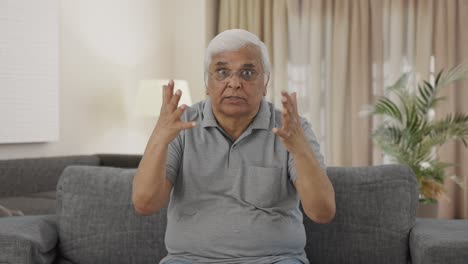 Angry-Indian-old-man-shouting-on-someone