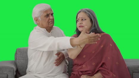 Angry-Indian-Old-couple-fighting-for-TV-remote-Green-screen