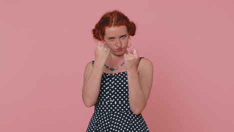 Greedy-avaricious-redhead-young-woman-showing-fig-negative-gesture,-rapacious-avaricious-acquisitive