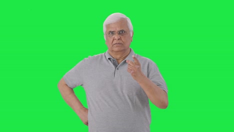 Angry-Indian-old-man-looking-at-the-camera-Green-screen