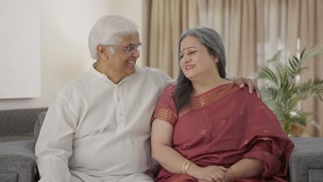 Cute-Old-Indian-couple-smiling-to-the-camera