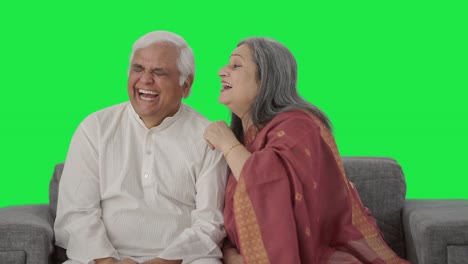 Happy-Old-Indian-wife-telling-a-secret-to-her-husband-Green-screen