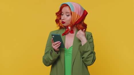 Redhead-girl-using-mobile-phone-typing-post-on-web-sms-message-browsing-addiction-of-social-networks