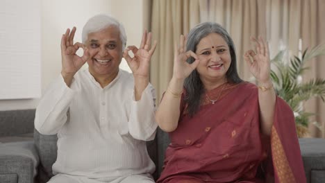 Happy-Old-Indian-couple-showing-okay-sign