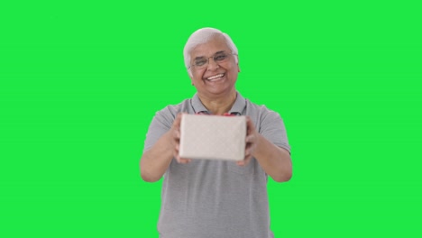 Happy-Indian-old-man-giving-a-gift-Green-screen