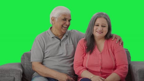 Happy-Indian-old-couple-talking-and-smiling-Green-screen