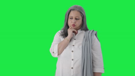 Confused-Indian-senior-businesswoman-thinking-Green-screen