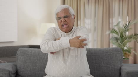 Sick-Indian-old-man-suffering-from-arthritis