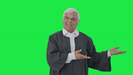 Happy-Indian-senior-lawyer-presenting-his-case-in-court-Green-screen