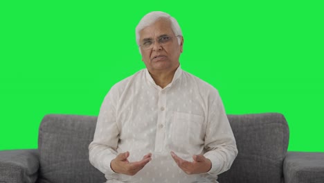 Indian-old-man-talking-to-the-camera-Green-screen