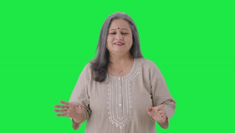 Happy-Indian-old-woman-talking-to-the-camera-Green-screen