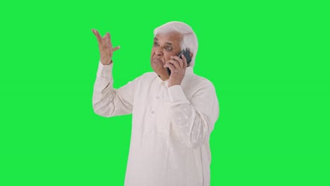 Angry-Indian-old-man-shouting-on-phone-Green-screen