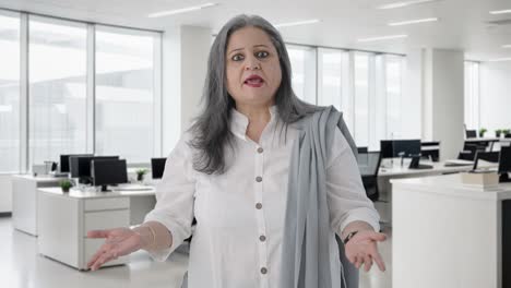 Angry-Indian-senior-businesswoman-shouting