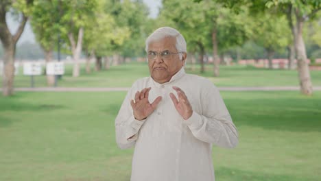 Afraid-Indian-old-man-scared-of-someone-in-park